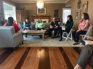 Group gathered in living room for discussion.